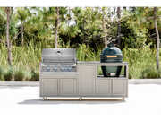 Outdoor kitchen setup with a grill and a large green ceramic pot on a stand.