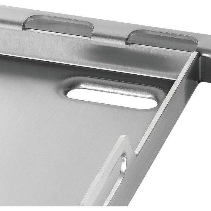 Close-up of a stainless steel grill pan with handles on a white background