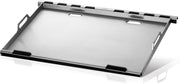 Metallic tray with black handles on a reflective surface