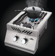 Portable gas stove with a pot on a black background