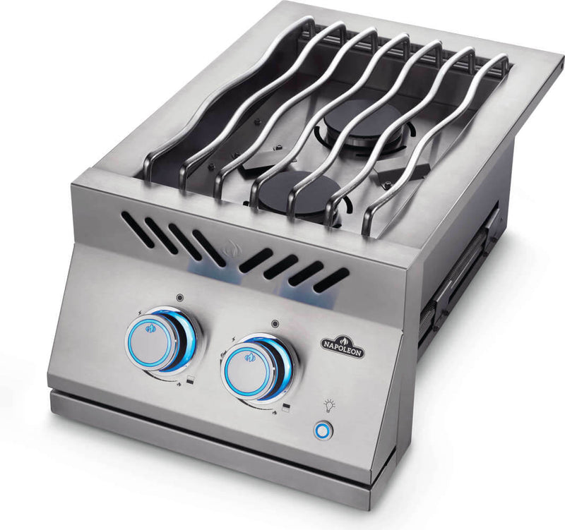Stainless steel gas cooktop with four burners on a white background