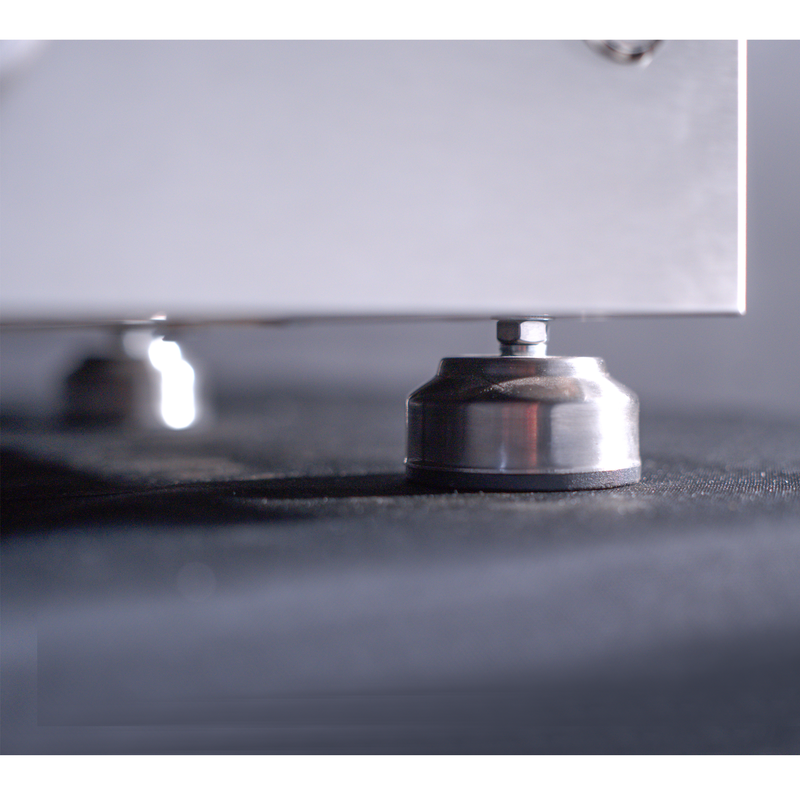 Close-up of a metal object on a reflective surface