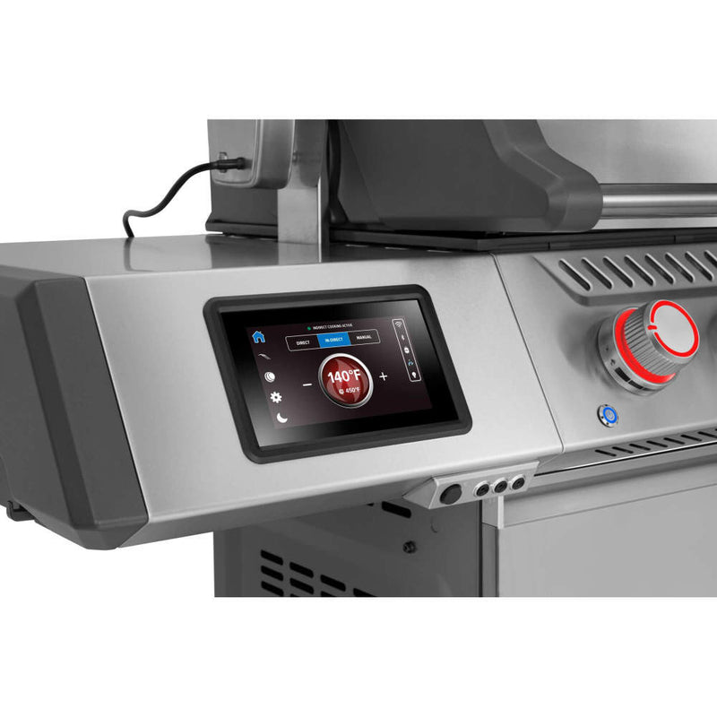 Close-up of a grill with digital display and control knobs on a white background