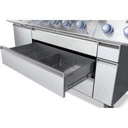 Stainless steel grill with a drawer open on a white background