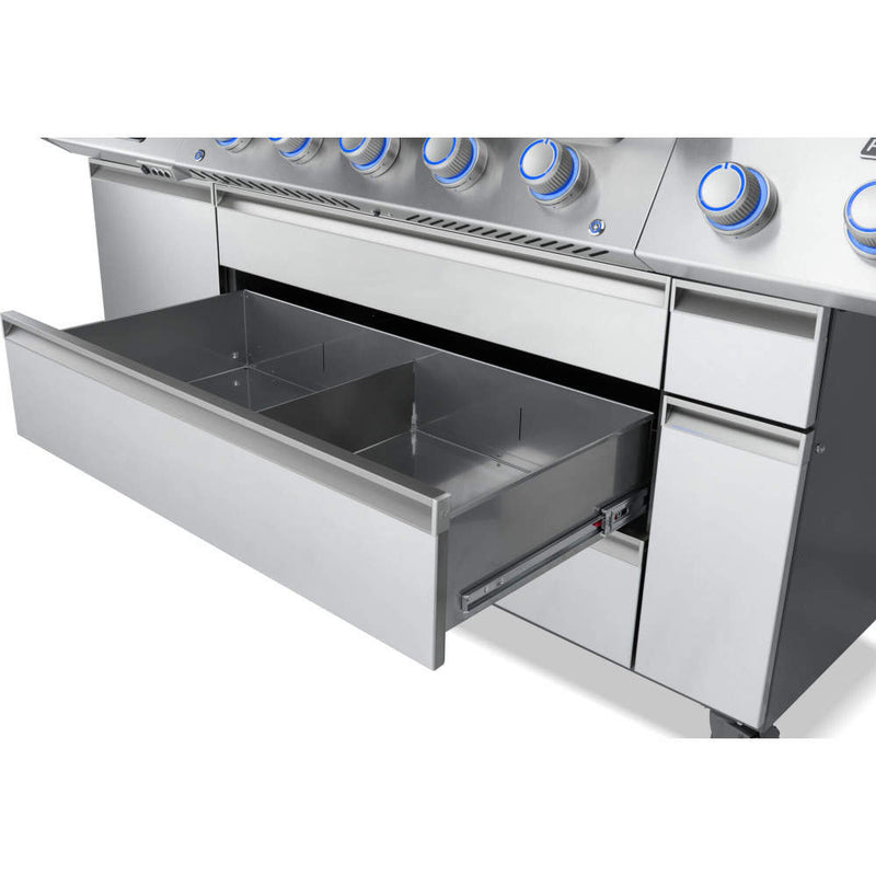 Stainless steel grill with a drawer open on a white background