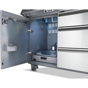 Commercial kitchen refrigerator with open door showing interior compartments.