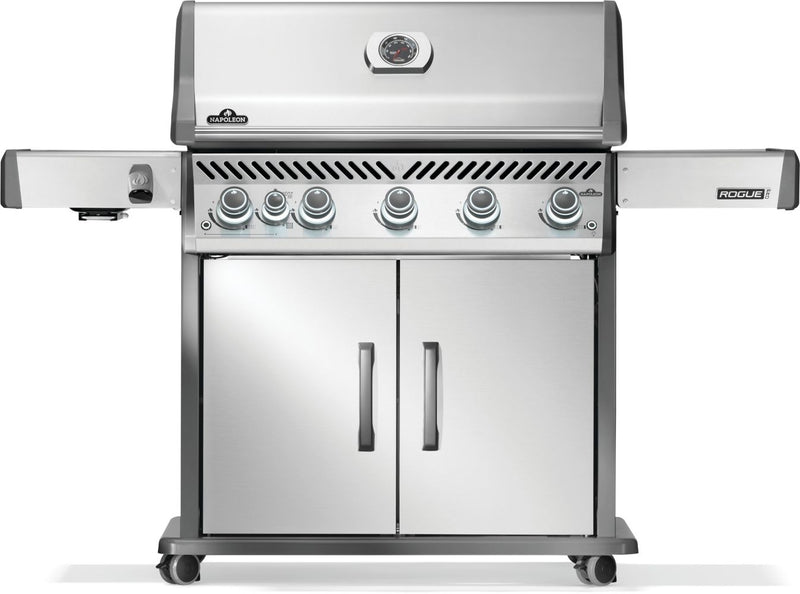 Stainless steel grill with multiple burners on a white background