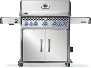 Stainless steel grill with multiple burners on a white background