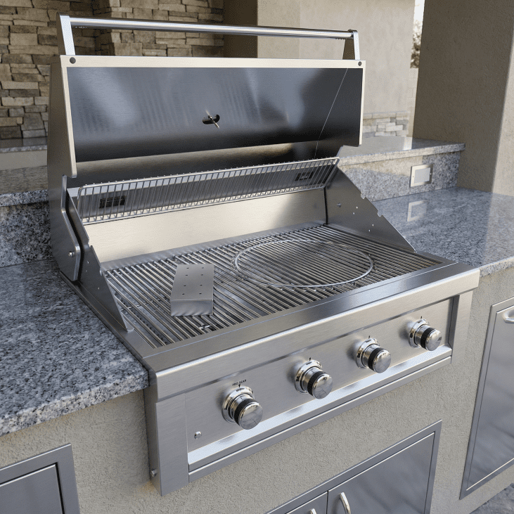 Stainless steel gas grill on a outdoor kitchen counter with stone wall background