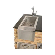 Stainless steel outdoor sink with faucet built into stone countertop