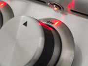 Close-up of a metallic control knob with 'OFF' label and red indicator light.