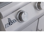 Close-up of a Blaze grill control knob with the Blaze logo.