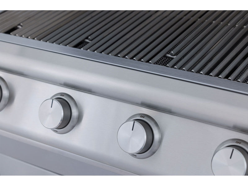 Stainless steel grill with control knobs on a blurred background