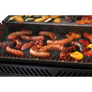 Grill with sausages and vegetables cooking on a white background
